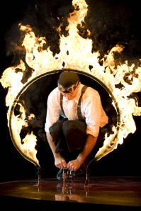 Justin Case Bicycles through a Ring of Fire in Ringling Bros. Coney Island Boom A Ring Circus. Photo by rbbbconeyisland via flickr