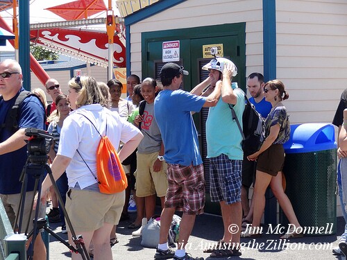 Extra being outfitted with GoPro helmet cam to ride the Air Race, Luna Park. July 21, 2012. Photo © Jim McDonnell Film Shoot